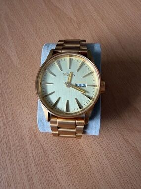 Nixon Sentry Stainless Steel Men's Gold-Tone Bracelet Watch with Day-Date 42mm